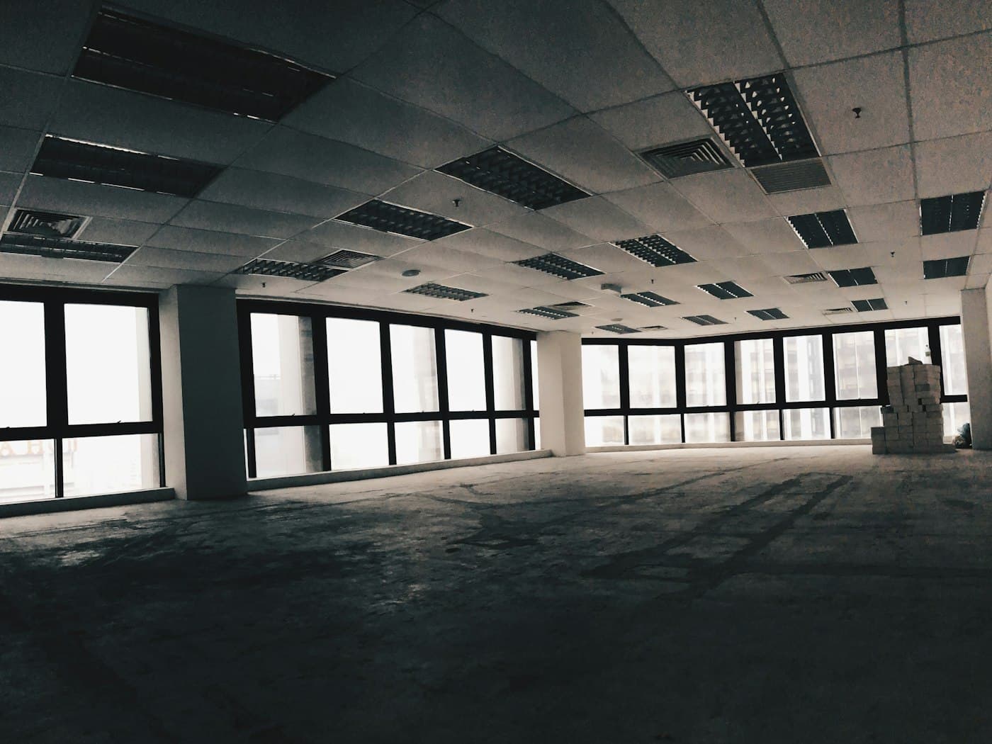 Empty open plan office floor cleaned after hours