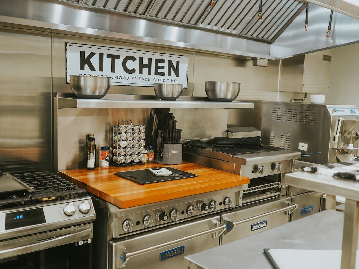 Stainless steel commercial kitchen cooking line ready for a degrease